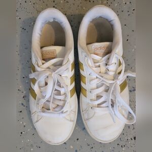 Adidas White Sneakers with Gold Stripes